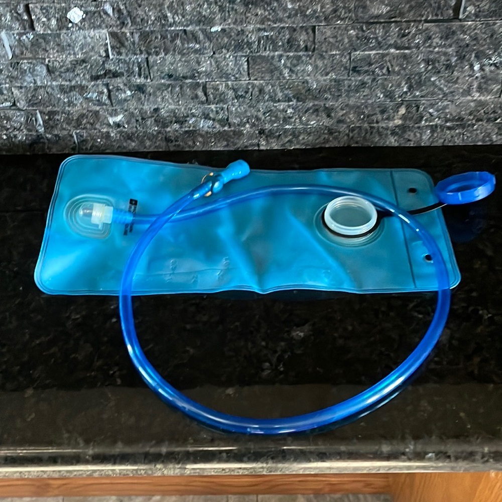 New, Mountain Warehouse two litre hydration pack! Lightweight and collapsible.